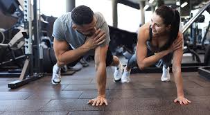 Toning Bingo Wings: Your Ultimate Guide to Sculpting Sleek Arms at the Gym 3 Fitness trainer demonstrating arm toning exercises West Sussex