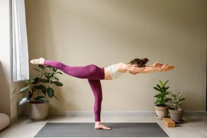 Achieving the Perfect Tone: How Often Should You Exercise for Results? 1 Woman doing Yoga exercise West Sussex to help with toning the body.