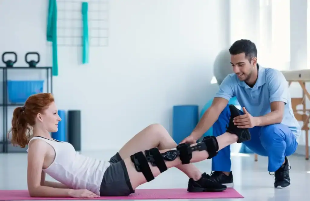 Debunking Meal Timing Myths: The Truth About Muscle Recovery 1 Woman having treatment to help muscle recovery West Sussex after an injury